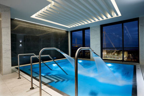 Spa pool with water jets with a view of the rooftops of Cardiff